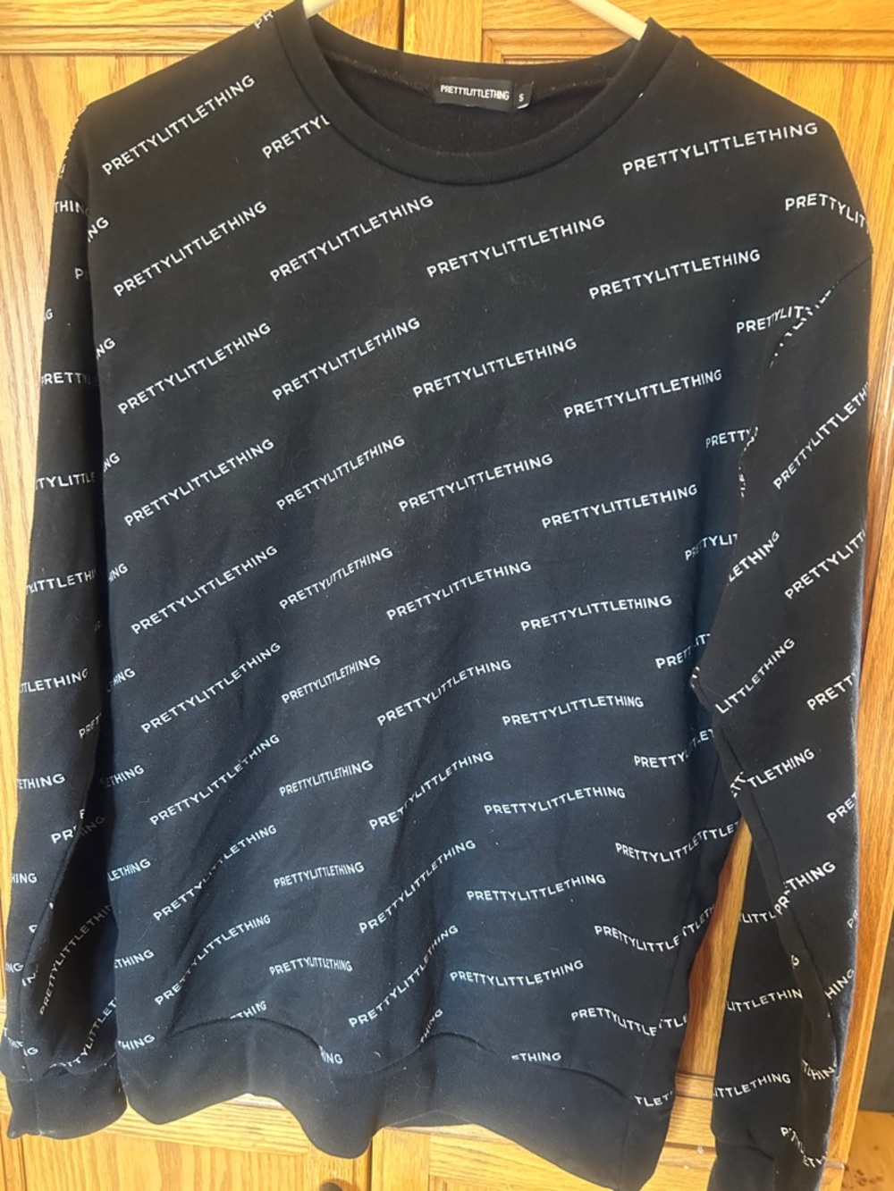 PrettyLittleThing Black All-Over Logo Crewneck Sweater